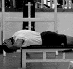 头压铁片颈屈伸.gif